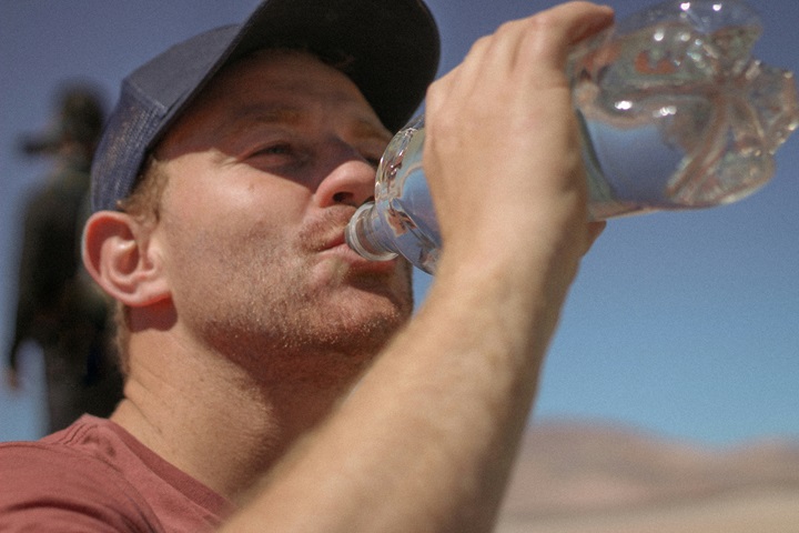 man drinking filtered water.